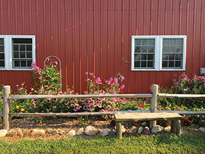 whispering orchards flower bed on south of restaurant